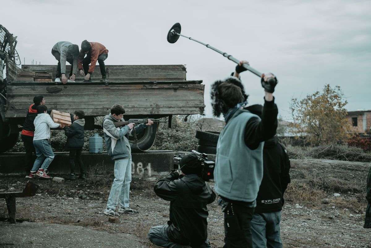 Film crew working on a movie set, representing production liability and stunt performer insurance