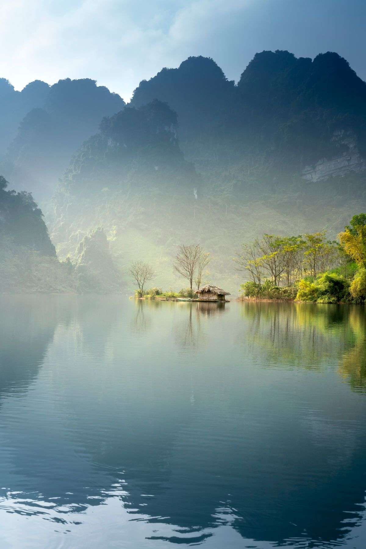 Misty lake at dawn evoking mysterious, novelty insurance policies like Loch Ness Monster coverage
