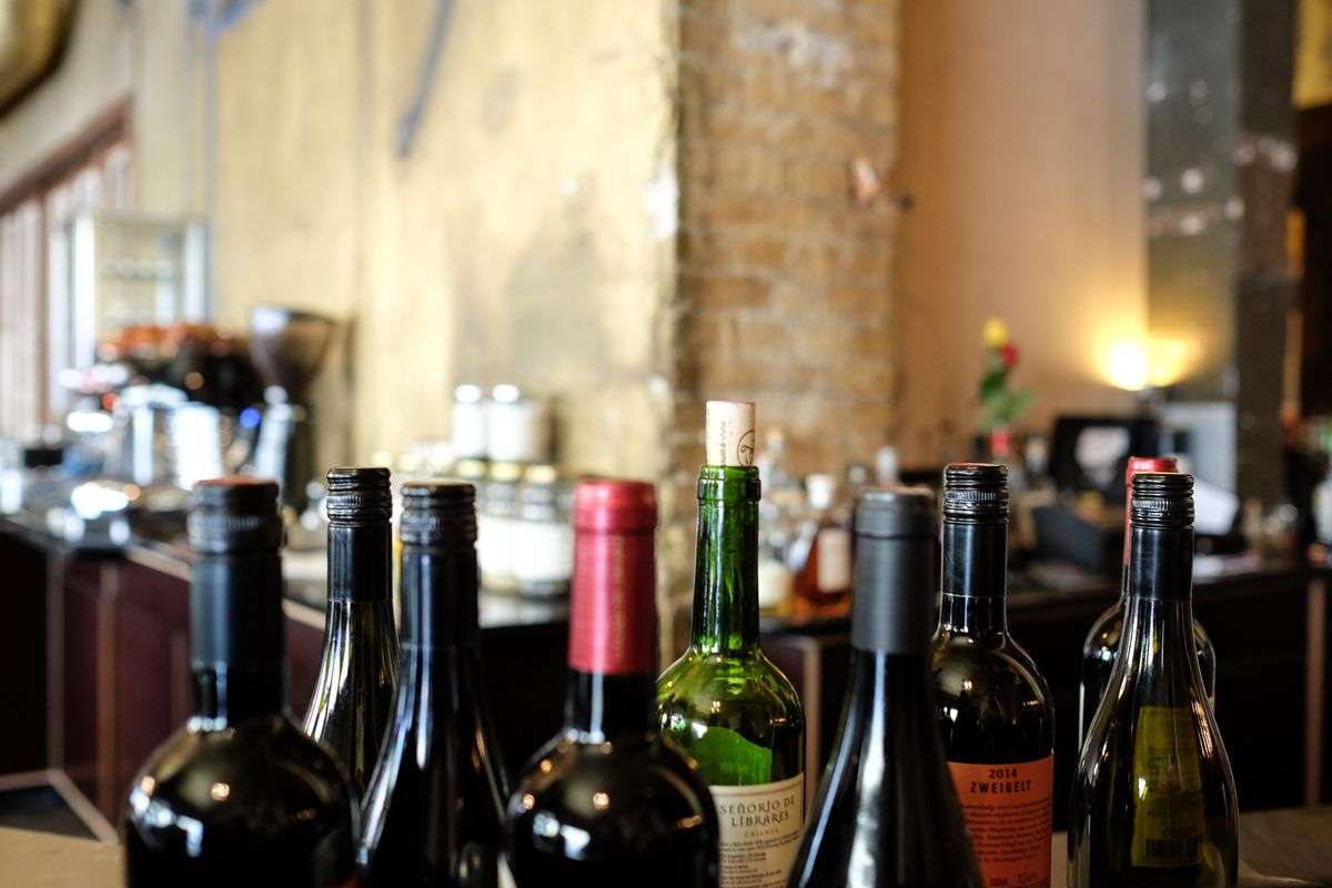 Wine glass and bottle representing a winemaker's nose insurance policy from Lloyd's of London