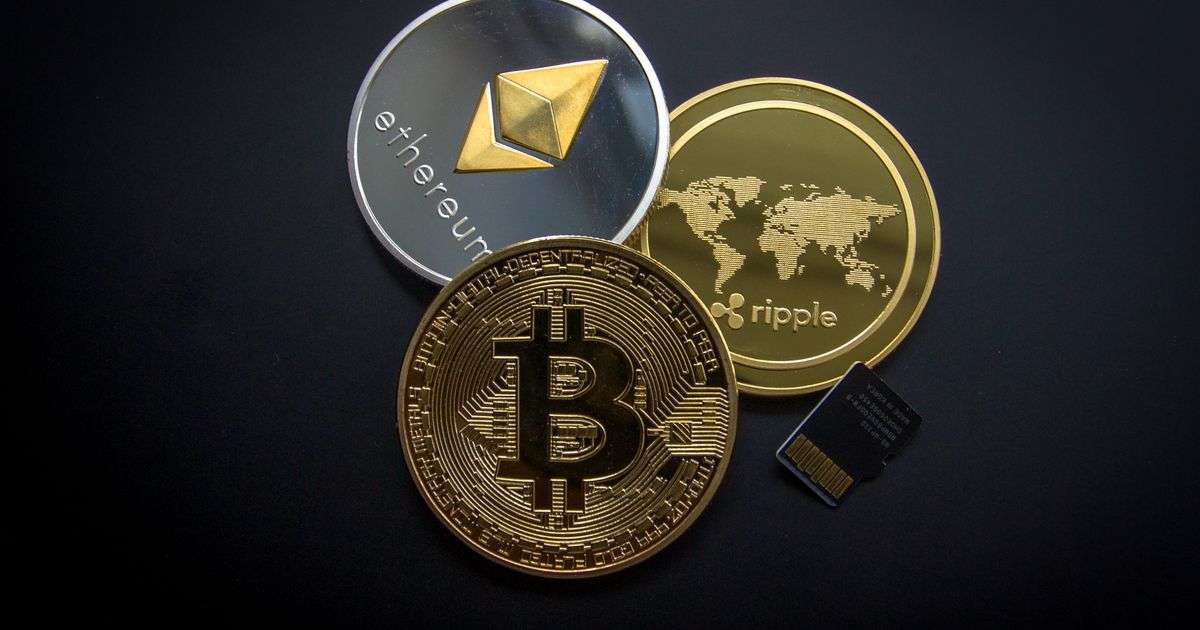 Gold bitcoin coin on a dark surface, representing crypto and digital asset insurance