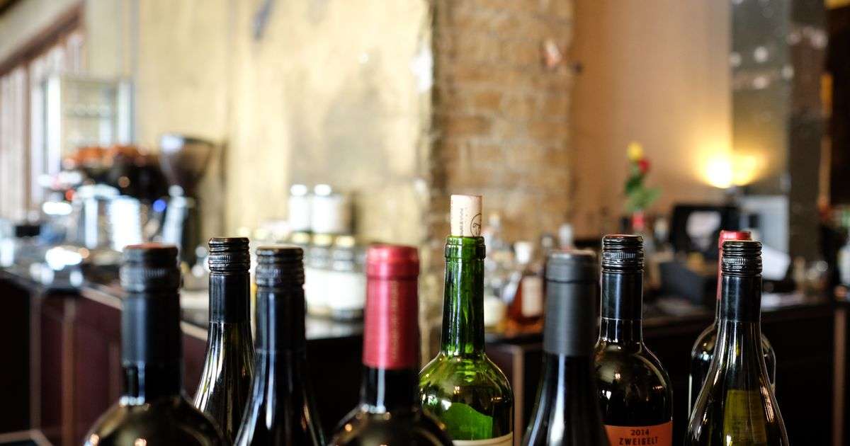 Wine glass and bottle representing wine collection insurance for collectors